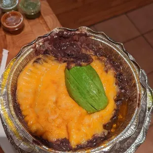 "Queso fundido" aka congealed cheddar and soupy beans.