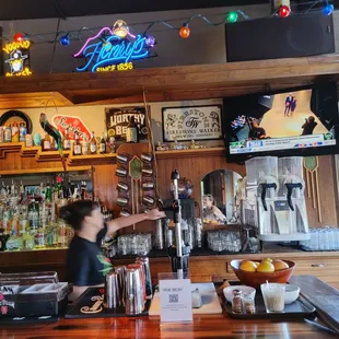 a woman behind the bar