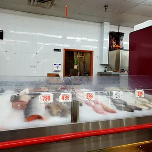 April 2021: Against the back wall...they will cut &amp; package it for you