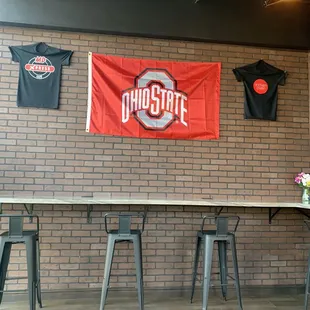 the ohio state flag hanging on the wall