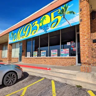 a car parked in front of the store