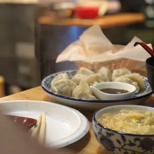 a bowl of soup and a bowl of dumplings