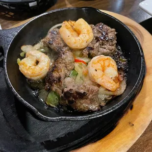 a skillet of food on a table