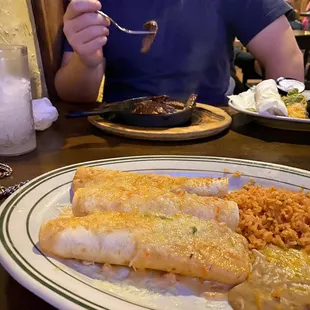 Front: walleye enchiladas Back: steak fajitas and a hungry boi