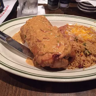 The Juana Burro. Shredded chicken, black beans, more in a deep fried shell. Good with a blackberry margarita.