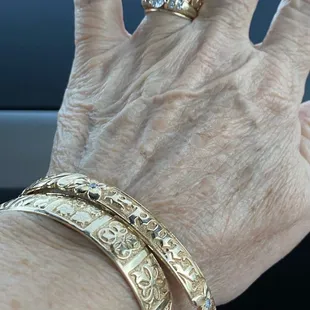 He did both bracelets and the Hawaiian ring.