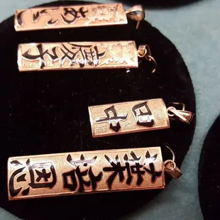 Kanji and hiragana enamel characters on 14k gold