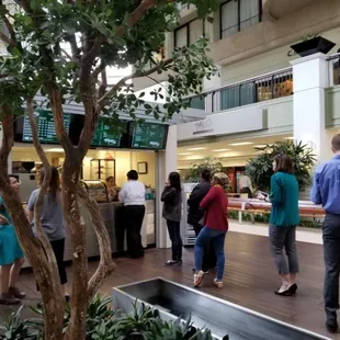 a group of people in a mall