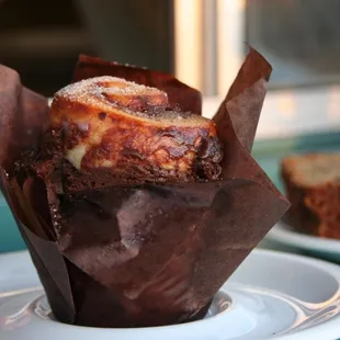 a chocolate muffin on a plate