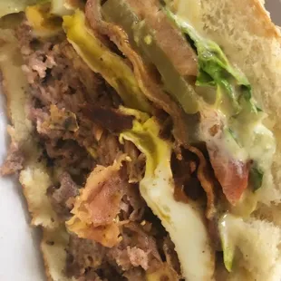 Who Dat burger! Ground meat | ham | bacon | eggs | fully dressed on bun! Must try