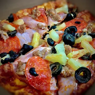 Personal pepperoni, olive, sausage, Canadian bacon, and pineapple pizza, yum !