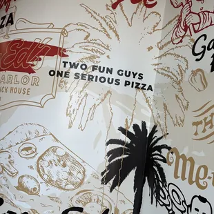 a pizza shop with a palm tree