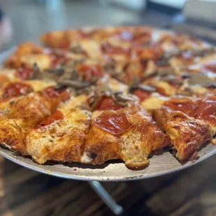Three topping - pepperoni, sausage and mushrooms