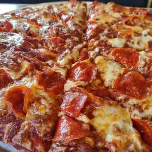 Large pepperoni with extra sauce cooked crispy.