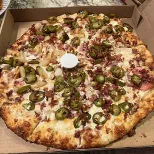 Hot Hawaiian that has about 4 pieces of Canadian bacon on it.