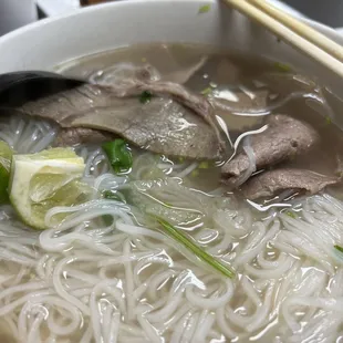 a bowl of beef and noodles