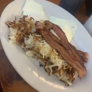 Eggs over medium bacon and hash