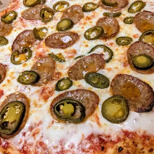 Large pepperoni and jalapeno pizza
