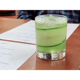 A tasty beverage called &quot;The Greener Side&quot;; TLC Vodka, Cucumber Juice, Basil Syrup and Topo Chico.