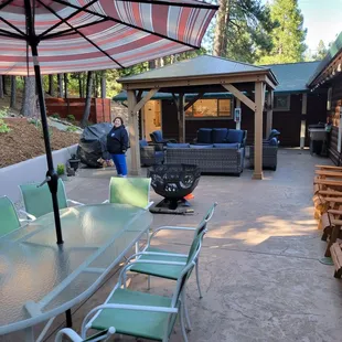 Fire pit, tables, patio furniture 2 gas BBQ grills, chairs and sink.  I think there was a laundry room but not sure if for Staff only