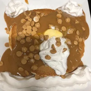 a pancake with peanut butter and whipped cream