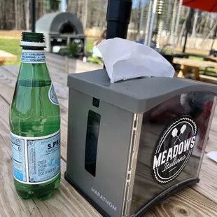 Picnic table. Portable pizza oven in back