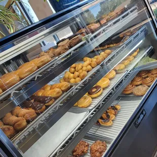 a display case filled with donuts