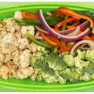 a plate of vegetables and chicken