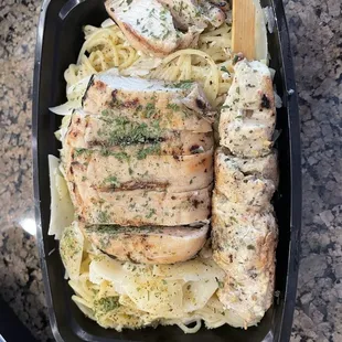 a chicken breast and noodles