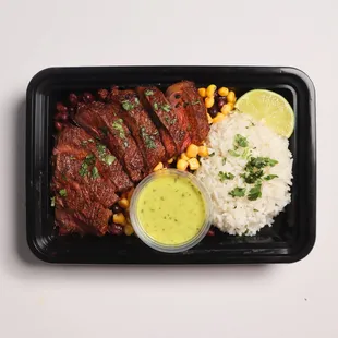 Carne Asada Bowl- marinated steak, rice/bean mix and cilantro like rice with avocado salsa