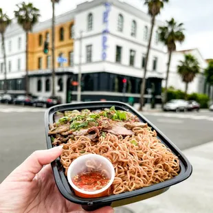 Tender kreoung-infused flank steak served with garlic wheat noodles, charred peppers and onions, and tuk trey fish sauce.