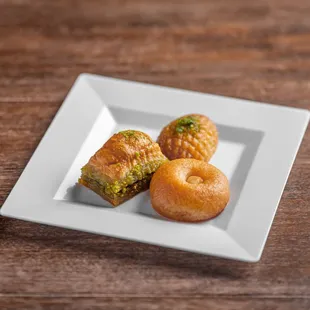 Dessert Sampler.
Double pistachio baklava, hazelnut cookie, and pistachio cake.