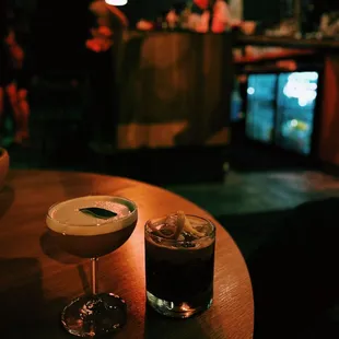 two cocktails on a table