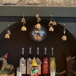 a bar with a disco ball hanging from the ceiling