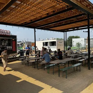 Outdoor seating by food trucks