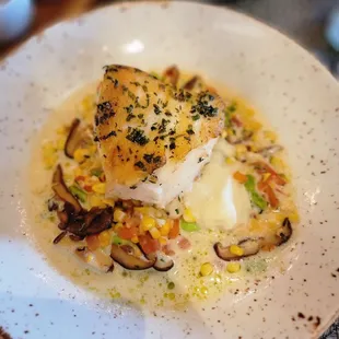 SEABASS TRUFFLE MASH  WILD MUSHROOMS  SWEET CORN  TOMATO CONCASSÉ  TRUFFLE NAGE  SOY BEAN