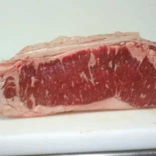 100% certified angus beef strip steak cut