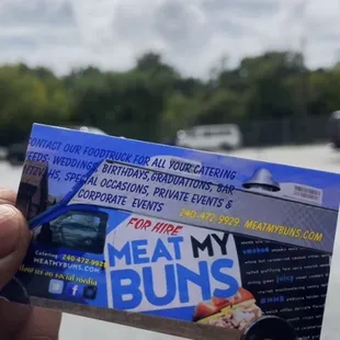 a person holding a business card