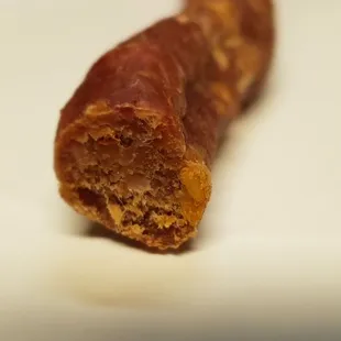 a sausage on a white plate