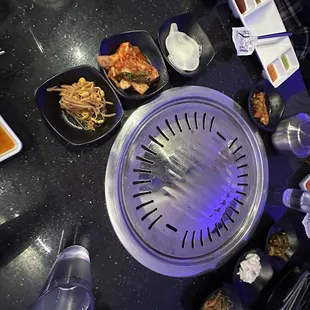 a hot pot with various foods on it