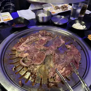 meat being cooked on a grill