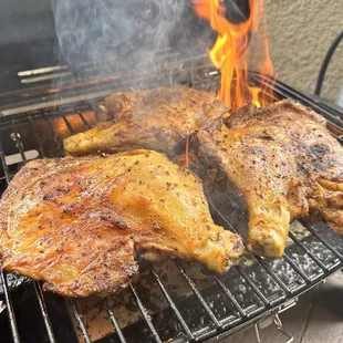 a close up of a chicken on a grill