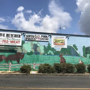 Mural of animals on side of building