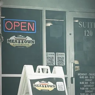 open sign in front of store