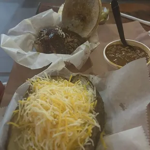 Brisket sandwich with potato and beans.