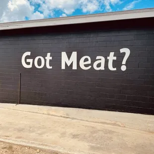 the words got meat? painted on the side of a building