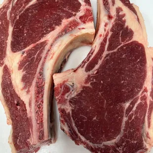 a piece of steak on a white plate