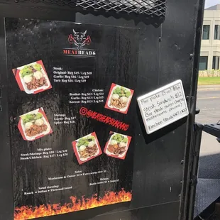 a menu on the side of a food truck