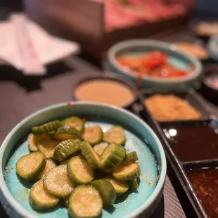 a variety of vegetables and dipping sauces