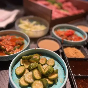a variety of vegetables in bowls on a table